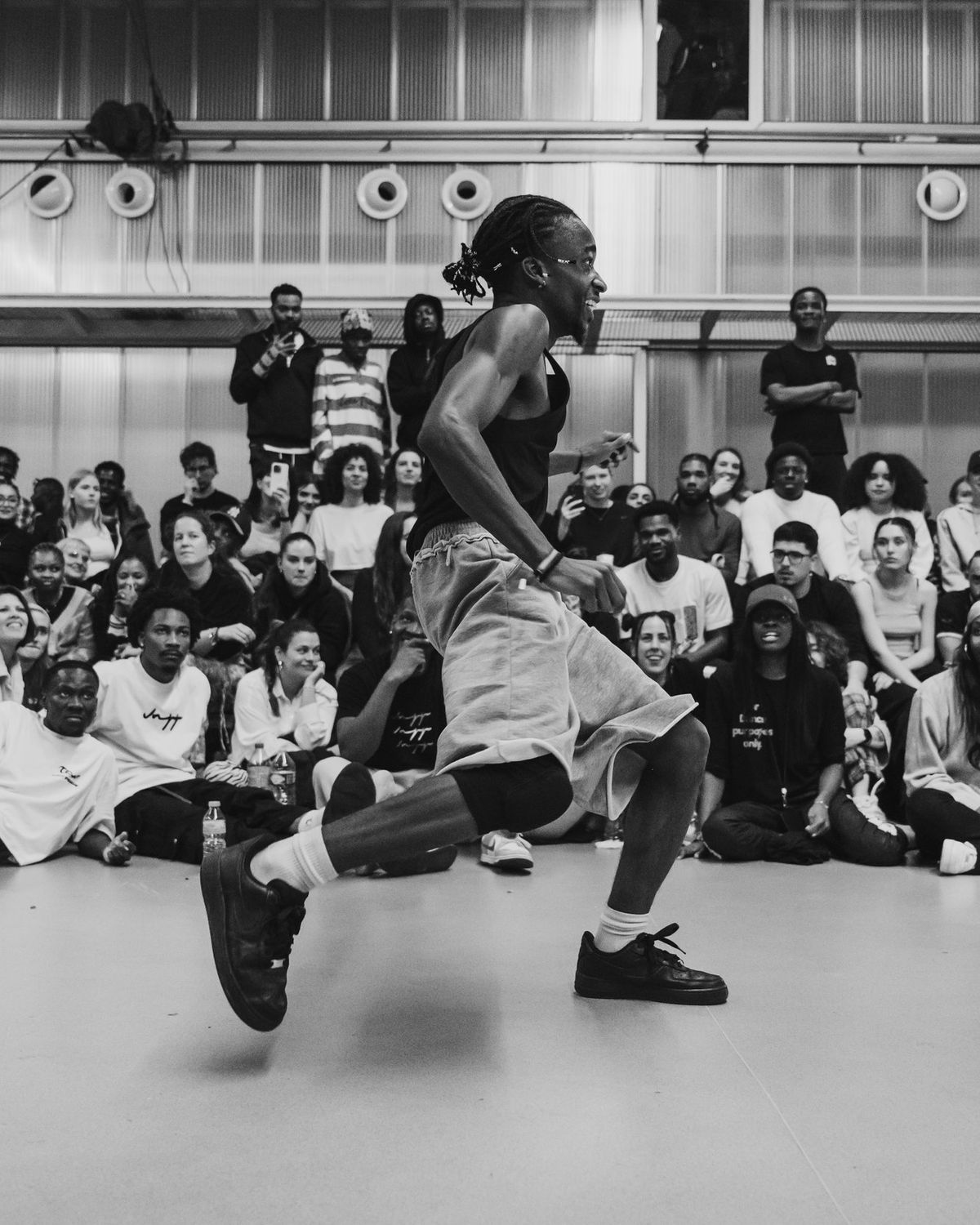 Two dancers mid-battle in front of the OYOFE crowd, Vol. 9